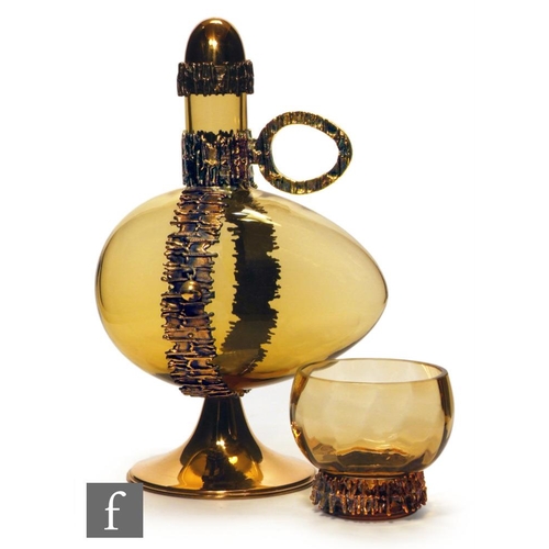 789 - Pertti Sarpaneva - Humppila - A Finnish glass decanter, circa 1979, the amber glass of egg form, fit... 