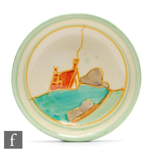 126 - Clarice Cliff - Secrets - A small circular pin dish circa 1933, hand painted with a partial cottage ... 