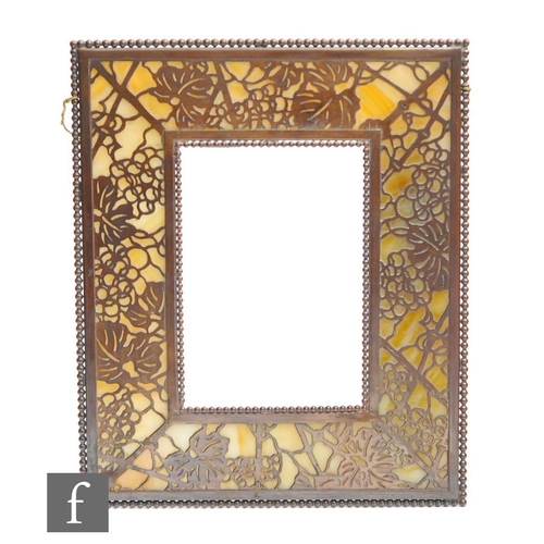 15 - Attributed to Tiffany Studio - An early 20th Century favrile glass and bronze photograph frame in th... 