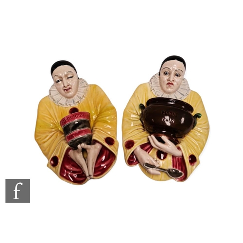 17 - Sarreguemines - A pair of late 19th Century majolica wall pockets modelled as Pierrot, one marked Ma... 