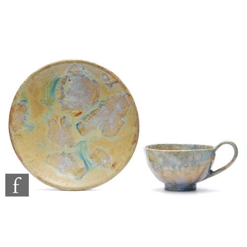 23 - Alexandre Bigot - Gres de Bigot - An early 20th Century French Art Nouveau cup and saucer, both piec... 