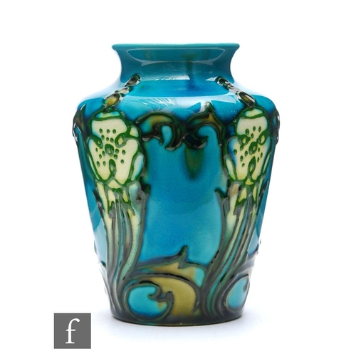 25 - Minton Seccessionist - A small early 20th Century vase decorated with tubed flowers and foliage agai... 