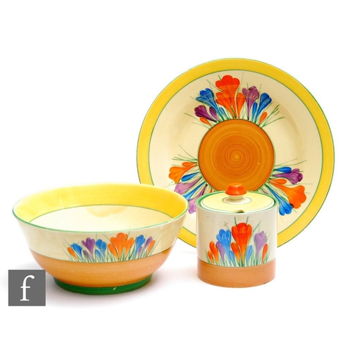 282 - Clarice Cliff - Crocus - A Drum shape preserve pot and cover circa 1930, hand painted with Crocus sp... 