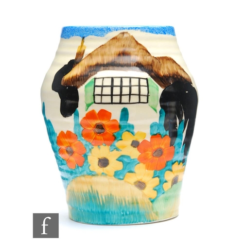 84 - Clarice Cliff - Tralee - A shape 569 vase circa 1935, hand painted with a stylised thatched cottage ... 