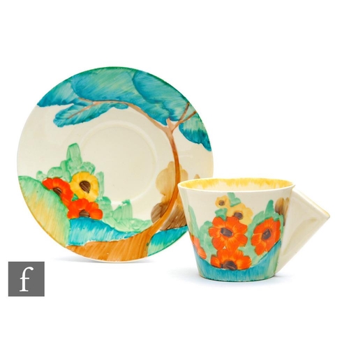 97 - Clarice Cliff - Fragrance - A Conical shape coffee cup and saucer circa 1935, hand painted with a st... 