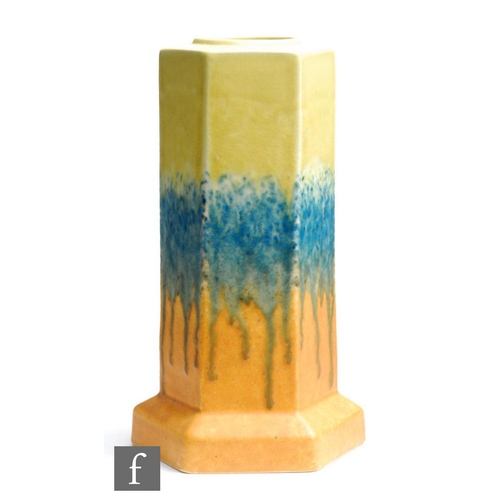 52 - Ruskin Pottery - A crystalline glaze vase of hexagonal form decorated in a yellow to blue to orange ... 