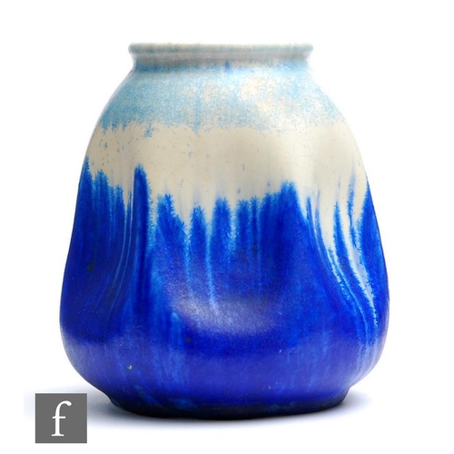 56 - Ruskin Pottery - A crystalline glaze vase of irregular form, the ovoid body with indented sides to f... 