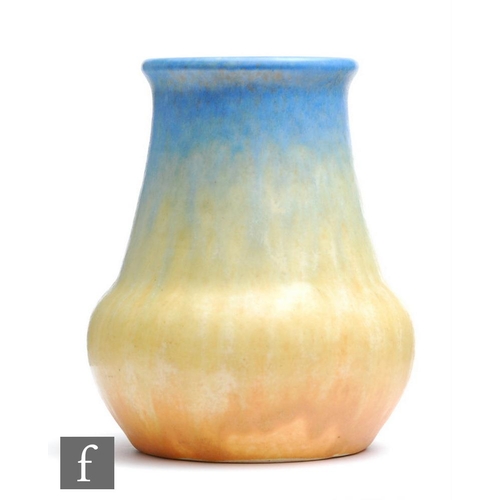 61 - Ruskin Pottery - A small crystalline glaze vase decorated in blue to yellow to orange, impressed mar... 