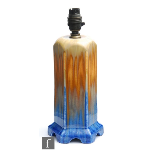 62 - Ruskin Pottery - A crystalline glaze hexagonal lamp base decorated in mustard to orange to blue with... 