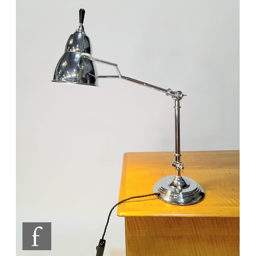 1221 - Unknown - A chrome adjustable desk lamp, the stepped circular base with tubular adjustable arms and ... 