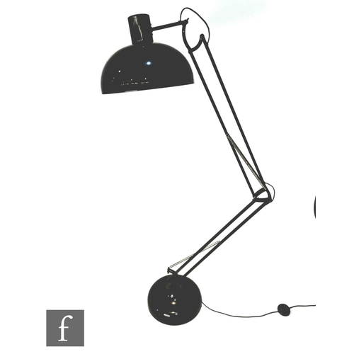 1225 - After Anglepoise - A black floor lamp, the domed base extending to an adjustable arm and shade, heig... 