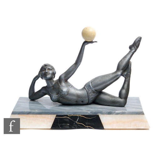 567 - Unknown - A French Art Deco spelter figure, circa 1930, modelled as a reclining female in a two piec... 