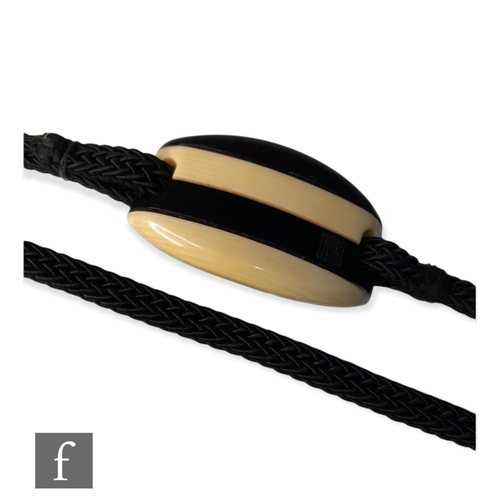 961 - Fendi - A vintage 1960s lucite belt, the black and white navette shaped buckle with thread black rop... 