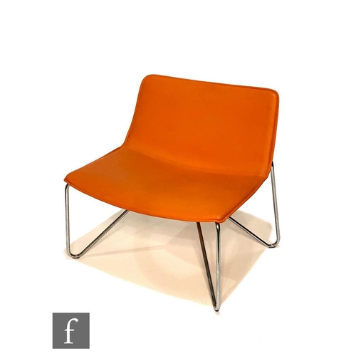 1172 - Unknown - A single orange leather and tubular chrome chair, the wide seat, on splayed chrome support... 