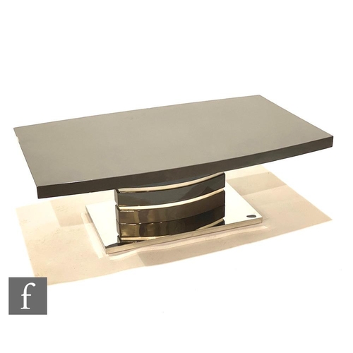 1181 - Unknown - A contemporary Italian high gloss coffee table, the curved grey rectangular top raised on ... 