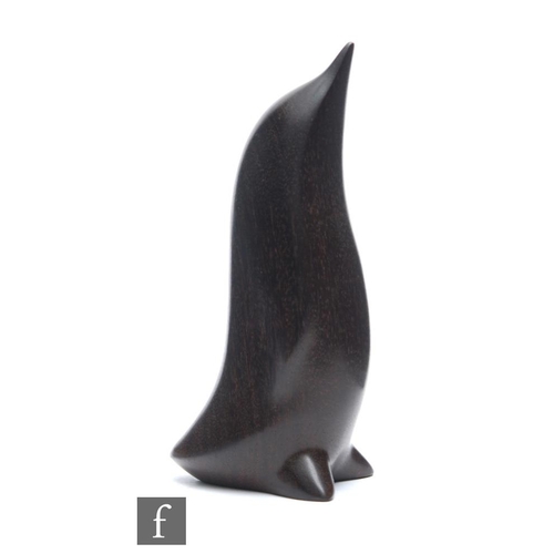 1247 - Perry Lancaster - A contemporary carved hardwood figure, modelled as a stylised penguin, signed PJL ... 