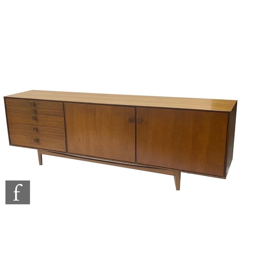 918 - Ib Kofod-Larsen - G-Plan - A teak sideboard, fitted with an arrangement of five graduated drawers to... 