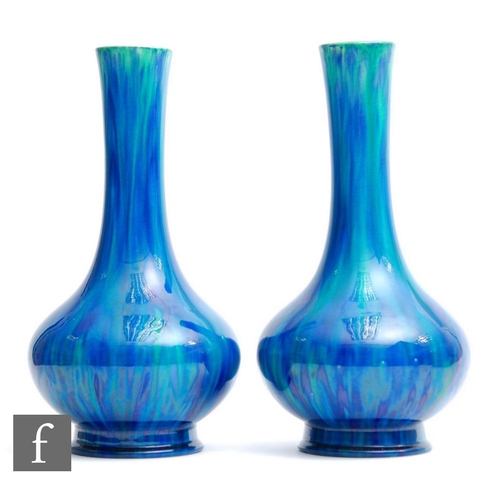 31 - Unknown - A pair of early 20th Century Arts and Crafts vases of footed globe and shaft form decorate... 