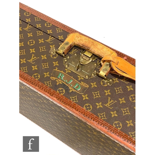 1136 - Louis Vuitton - A large Alzer hard case suitcase trunk, monogrammed leather with gold hardware, reta... 