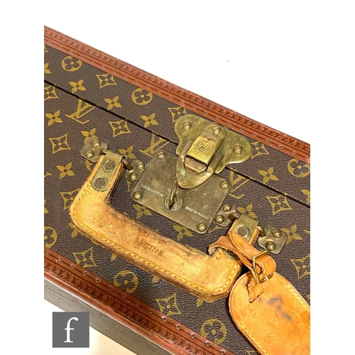 1136 - Louis Vuitton - A large Alzer hard case suitcase trunk, monogrammed leather with gold hardware, reta... 