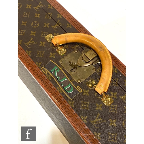 1137 - Louis Vuitton - A large Alzer hard case suitcase trunk, monogrammed leather with gold hardware, reta... 