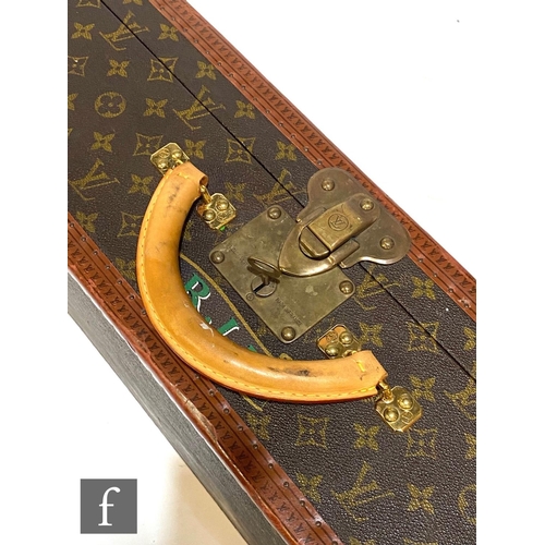 1137 - Louis Vuitton - A large Alzer hard case suitcase trunk, monogrammed leather with gold hardware, reta... 