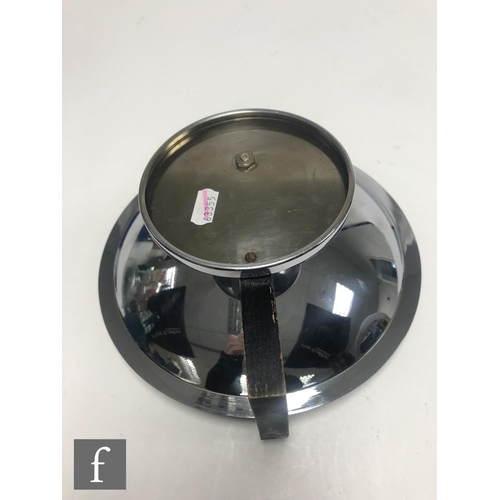 486 - Unknown - An Art Deco chrome plated circular bowl of plain form with black painted wooden side handl... 