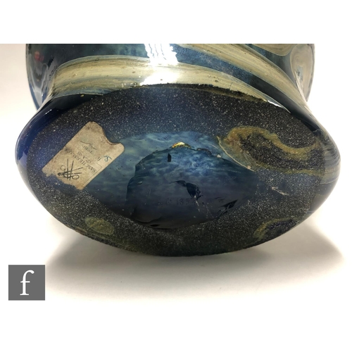 745 - Sam Herman - A large post war glass Head vase, of footed spherical form, decorated with mottled irid... 