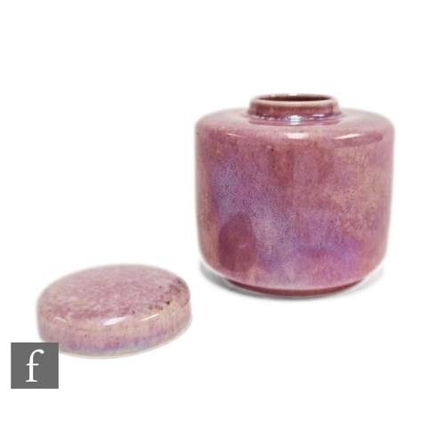 57 - Ruskin Pottery - A small caddy decorated in an all over Strawberry Crush lustre, impressed mark alon... 