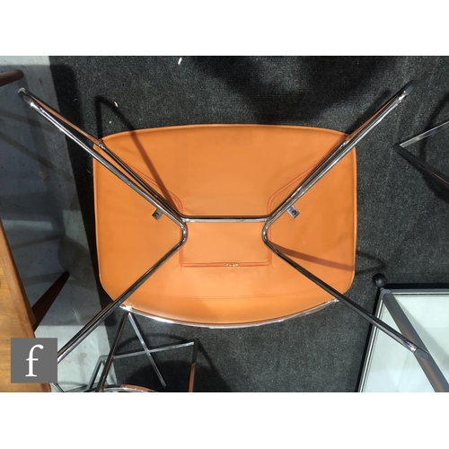 1172 - Unknown - A single orange leather and tubular chrome chair, the wide seat, on splayed chrome support... 