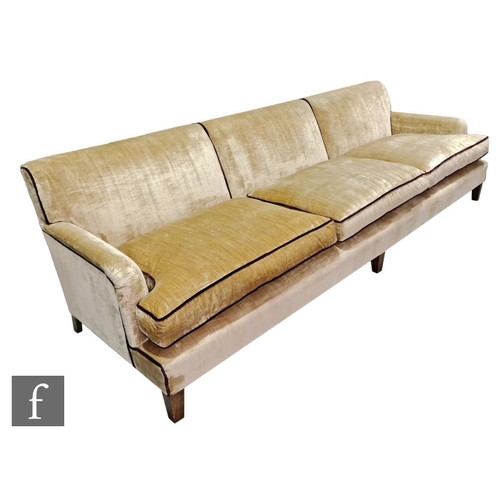 1177 - Unknown - A contemporary three seater sofa, the champagne coloured brushed velvet fabric with dark p... 