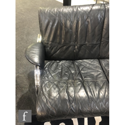 976 - Mark Lawson - Pieff Furniture - A three seat black leather upholstered sofa with chromium plated tub... 