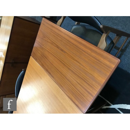 919 - Ib Kofod-Larsen - G-Plan - A model number 4399 teak extending dining table of rectangular form, with... 