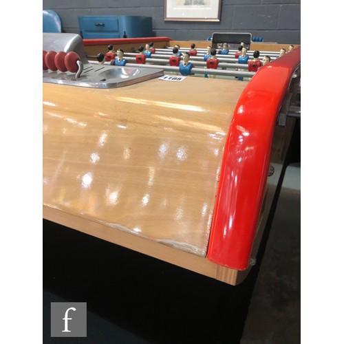 1185 - Bonzini - A French football table, the beech cabinet with red rails and raised on black splayed legs... 