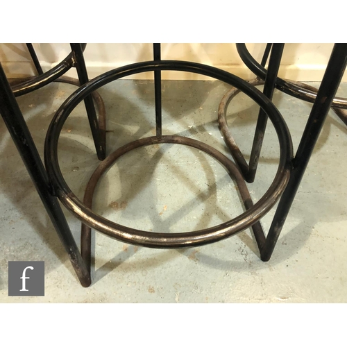 1263 - Morris of Glasgow - A set of four circular seated bar counter stools with rail backs over tubular st... 