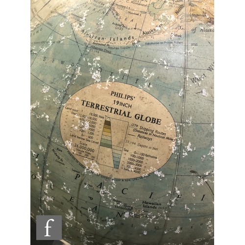 942 - George Philip & Son Ltd - A mid 20th Century 19 inch terrestrial globe, raised to a turned woode... 