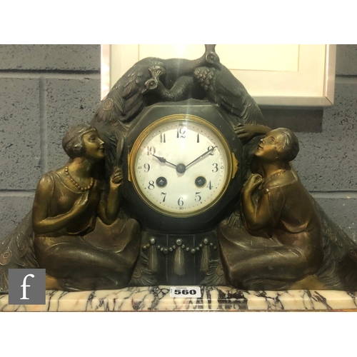 560 - P Sega - A French Art Deco patinated spelter mantle clock, the round gilt dial with Arabic numbers, ... 