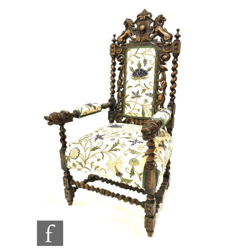 1214 - A Victorian carved oak elbow chair, the armorial lion back above twist supports over lion arms on co... 