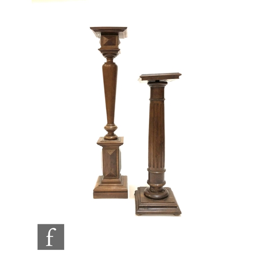 1215 - An Edwardian walnut square topped fluted torchere on stepped base, height 83cm, and a similar balust... 