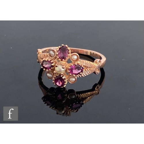 542 - A 9ct rose gold rhodalite and split pearl cluster ring, four rhodalites spaced by pearls, all to spl... 