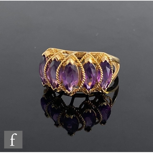 543 - A 14ct five stone amethyst ring, marquise claw set stones to split shoulders, weight 3.8g, ring size... 