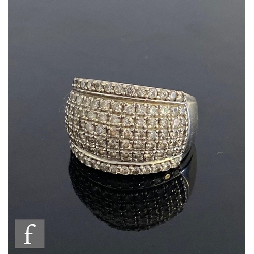 548 - A 9ct white gold pave set diamond ring comprising seven rows of claw set stones, weight 6.2g, ring s... 