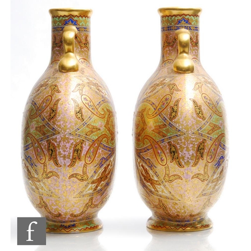 85 - A pair of 19th Century Coalport moonflasks each decorated in a Persian repeat pattern with Paisley m... 