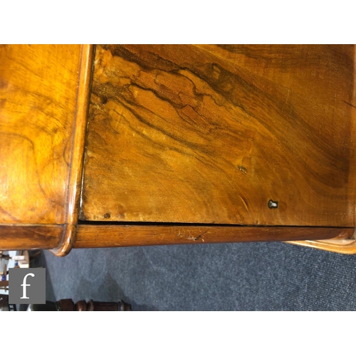 1236 - A Victorian figured walnut inverted breakfront partners desk by Edwards and Roberts, fitted with thr... 