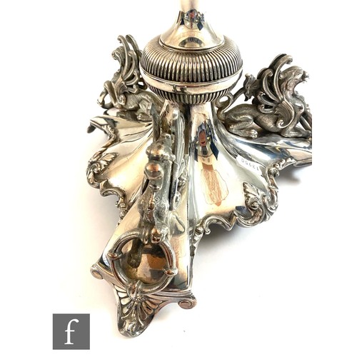 410 - A late 19th Century silver plated table centrepiece, tri form silver plated base decorated with thre... 