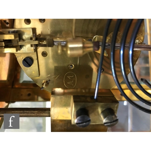 903 - A 19th Century French champleve enamelled brass clock garniture, the eight day movement striking on ... 