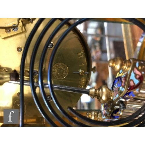 903 - A 19th Century French champleve enamelled brass clock garniture, the eight day movement striking on ... 