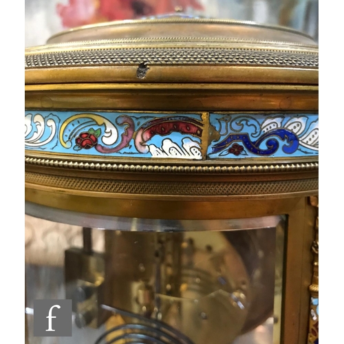 903 - A 19th Century French champleve enamelled brass clock garniture, the eight day movement striking on ... 