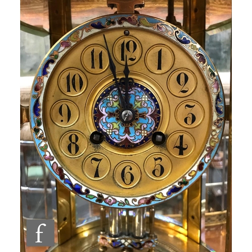 903 - A 19th Century French champleve enamelled brass clock garniture, the eight day movement striking on ... 