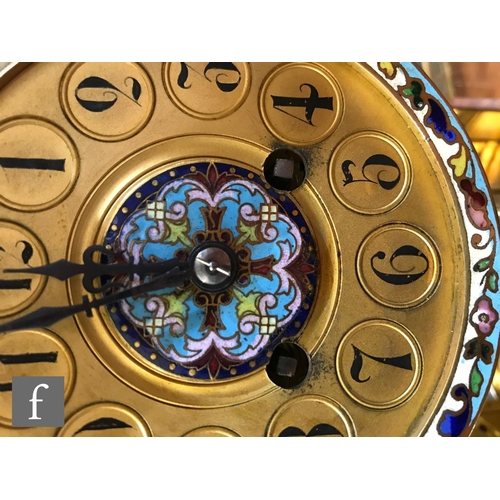 903 - A 19th Century French champleve enamelled brass clock garniture, the eight day movement striking on ... 